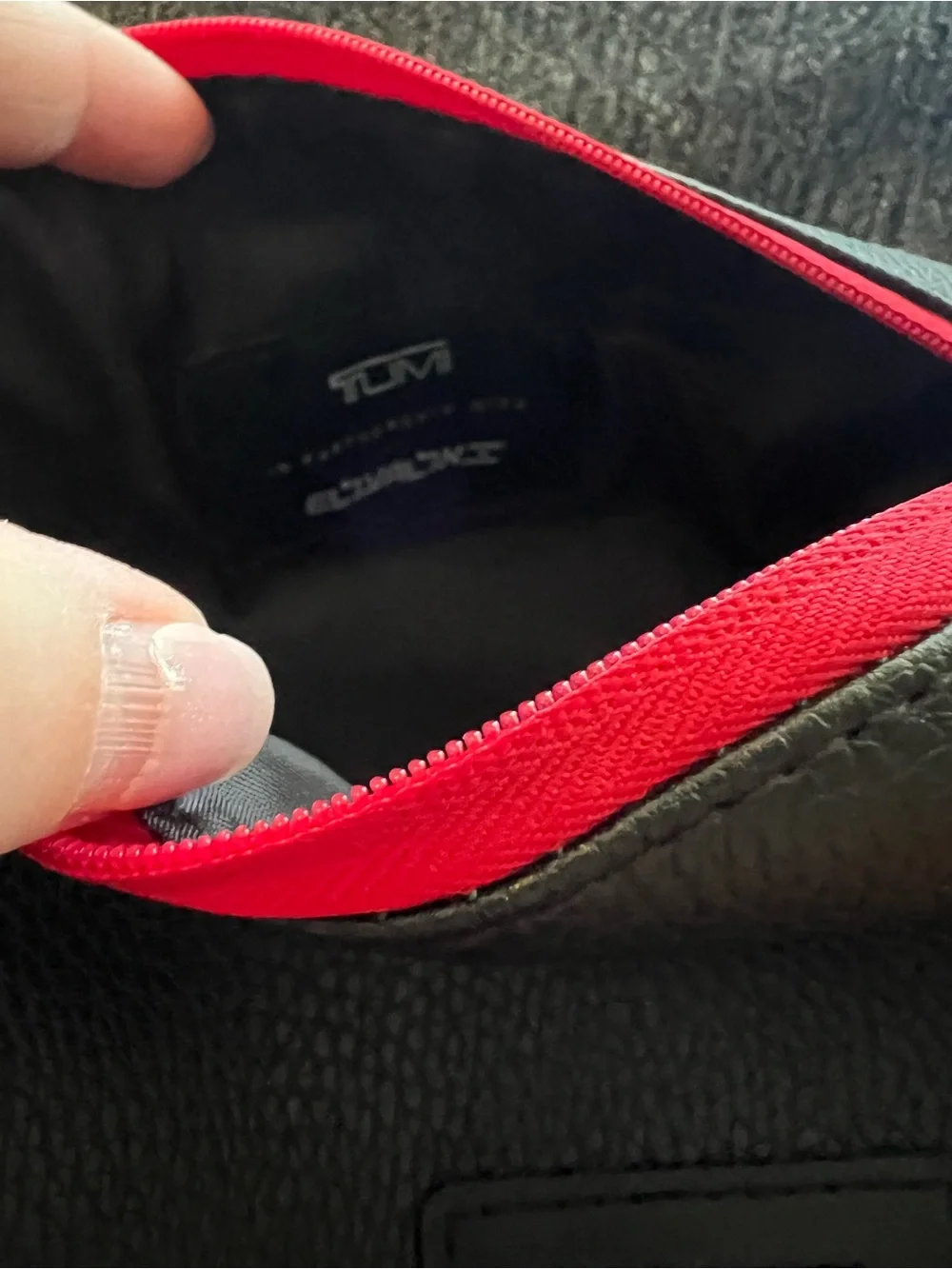 Tumi El Al Business Class Amenity Kit, featuring a black pebbled exterior
